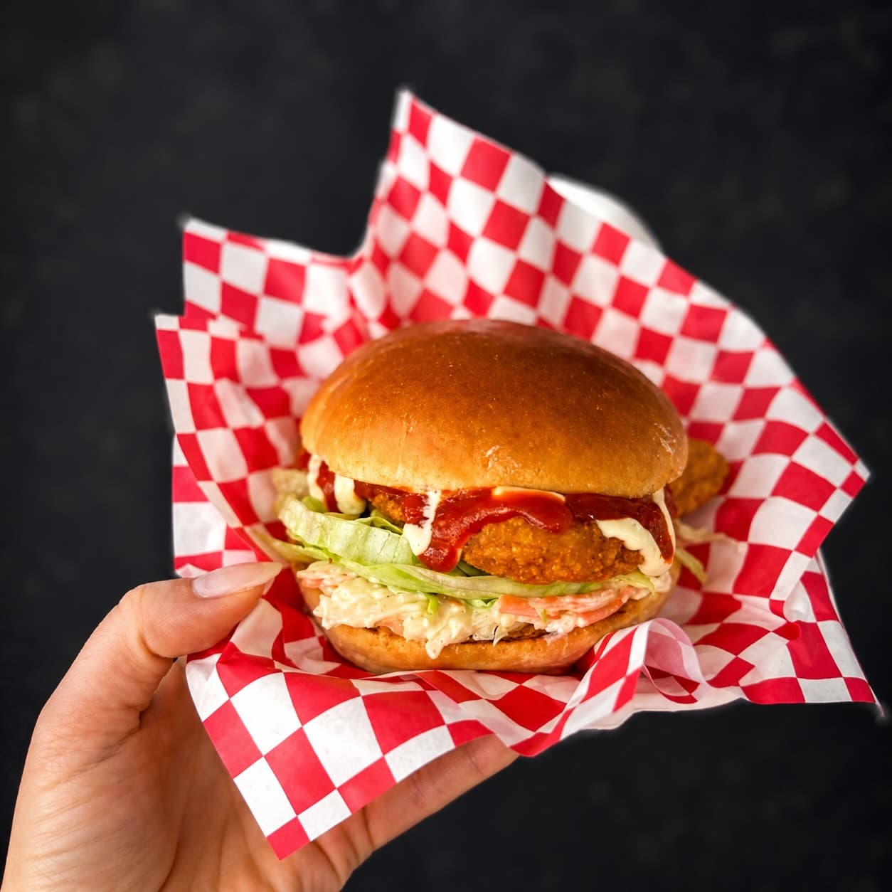 ReLoaded crispy chicken burger in a brioche bun