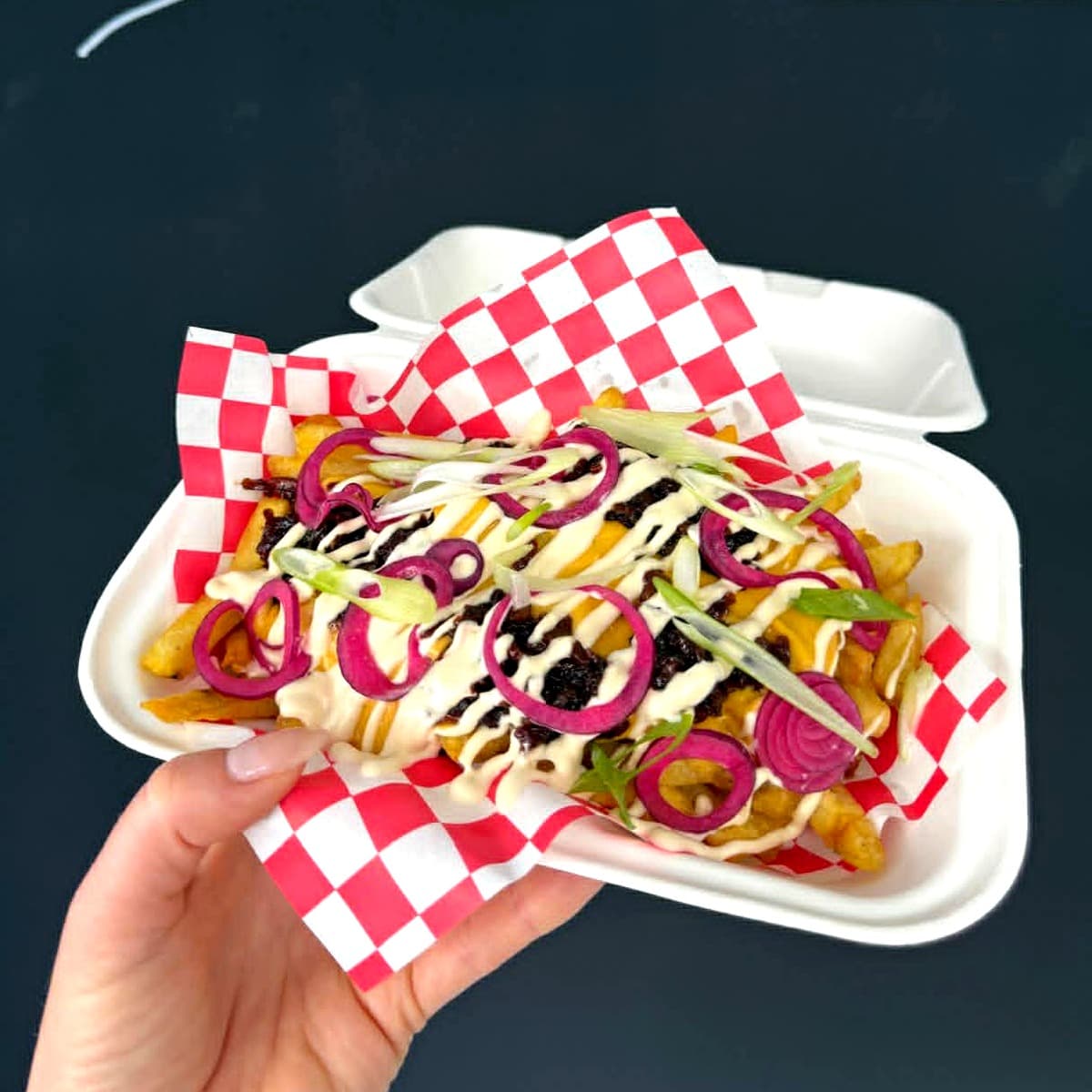 ReLoaded loaded fries topped with bacon jam and pickled onion